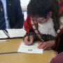 The Mayor signing her declaration of office